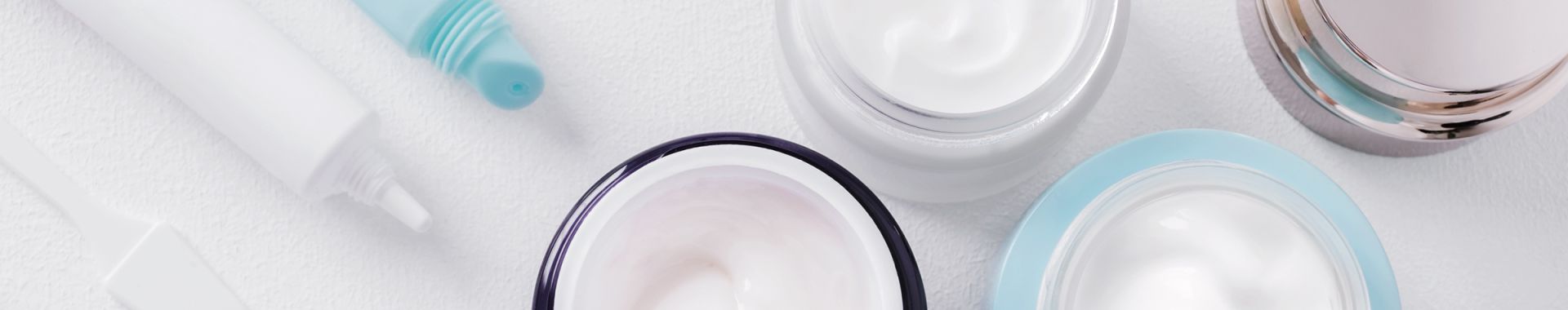 group of unlabeled skincare products